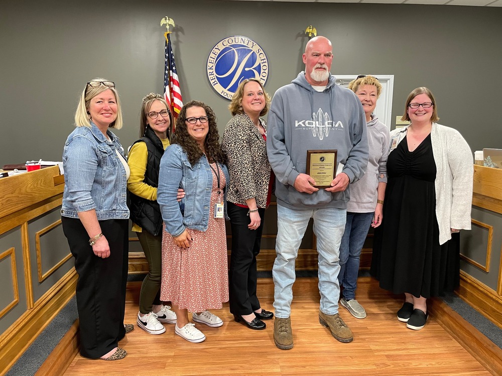 image of distinguished service award recipient john spidle with staff from berkeley heights elementary