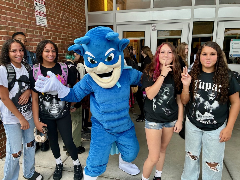  the blue devil mascot with a group of students on the first day