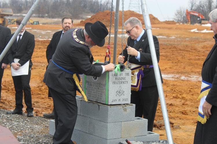 mason member laying the cornerstone