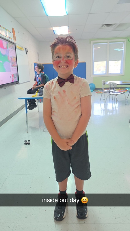 a student dressed like Anger from the movie "Inside Out"