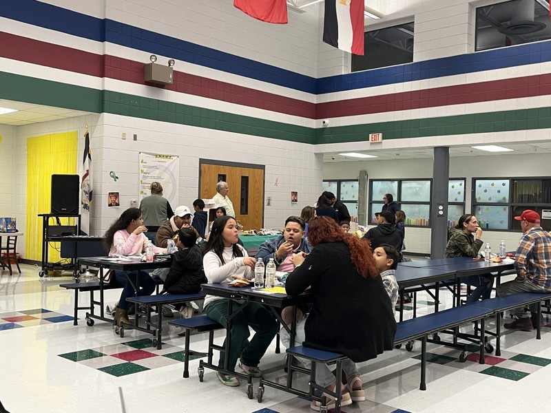 students & parents eating a meal