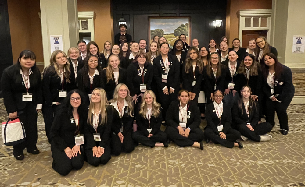 Group photo of more than 30 Berks Career & Technology Center HOSA students wearing black professional attire and conference badges at the Penn HOSA State Leadership Conference.