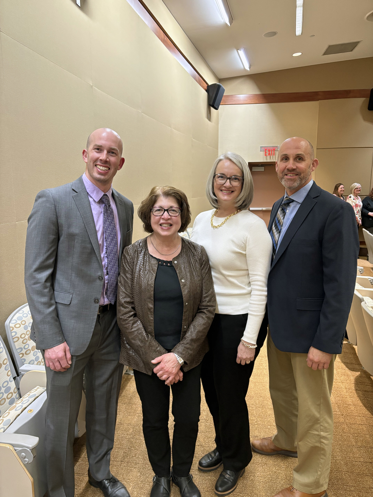 Group photo of four adults standing together indoors. Ms. Linda Keller, second from the left, stands with three Berks Career and Technology Center administrators. All are smiling and facing the camera.