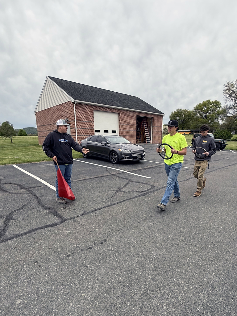 Heavy Equipment Operations students practice flagging signals and traffic direction during certification training.