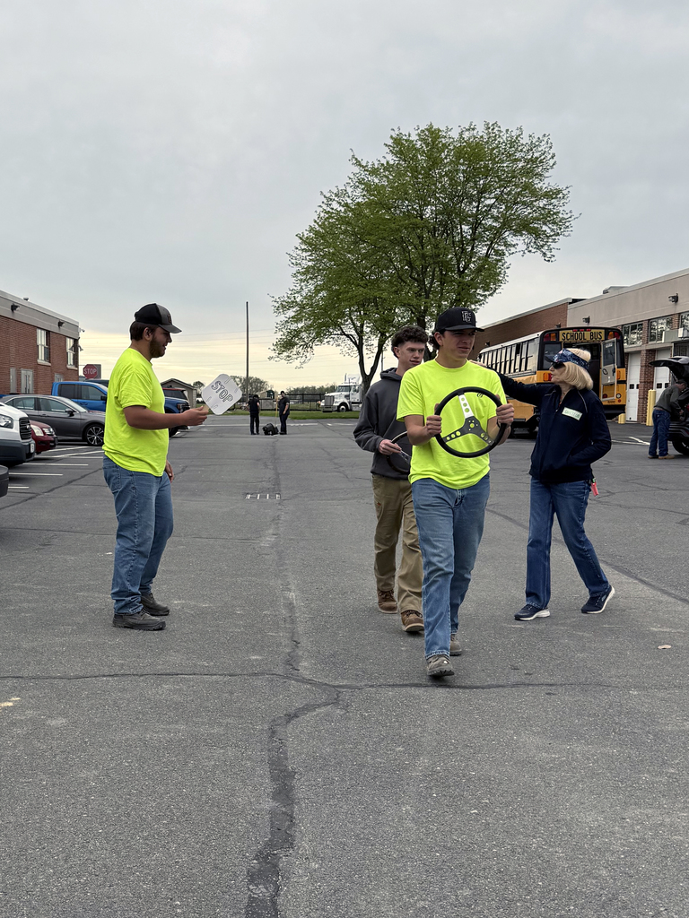 Heavy Equipment Operations students practice work zone safety procedures in a parking lot during PennDOT Flagger Certification training.