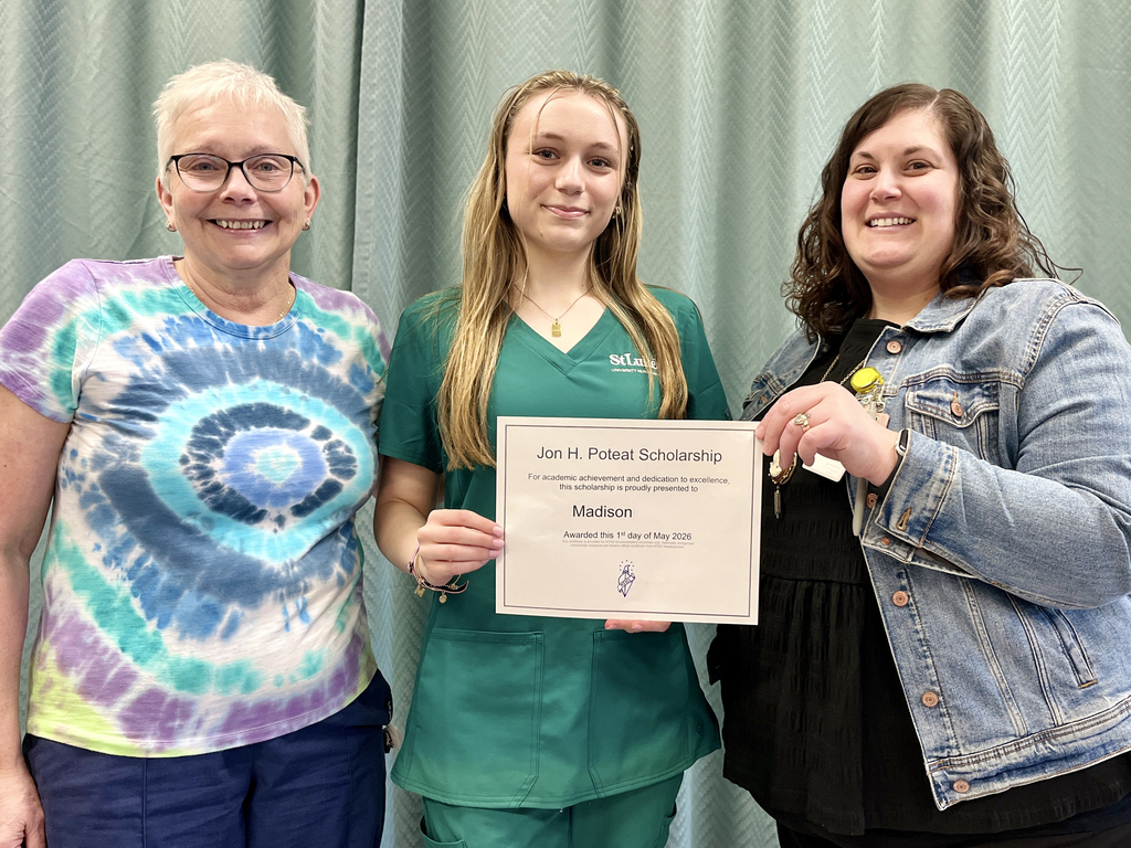 Madison stands with two Health Occupations staff members while holding her Jon H. Poteat Scholarship certificate.