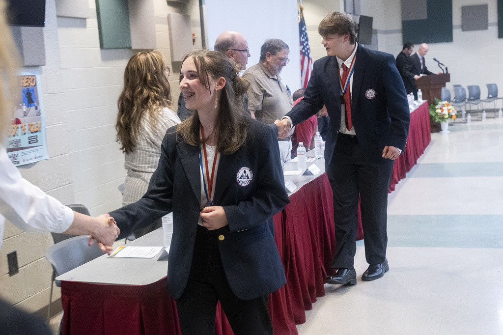 BCTC students shake hands with school representatives while being recognized during the Joint Operations Committee meeting.
