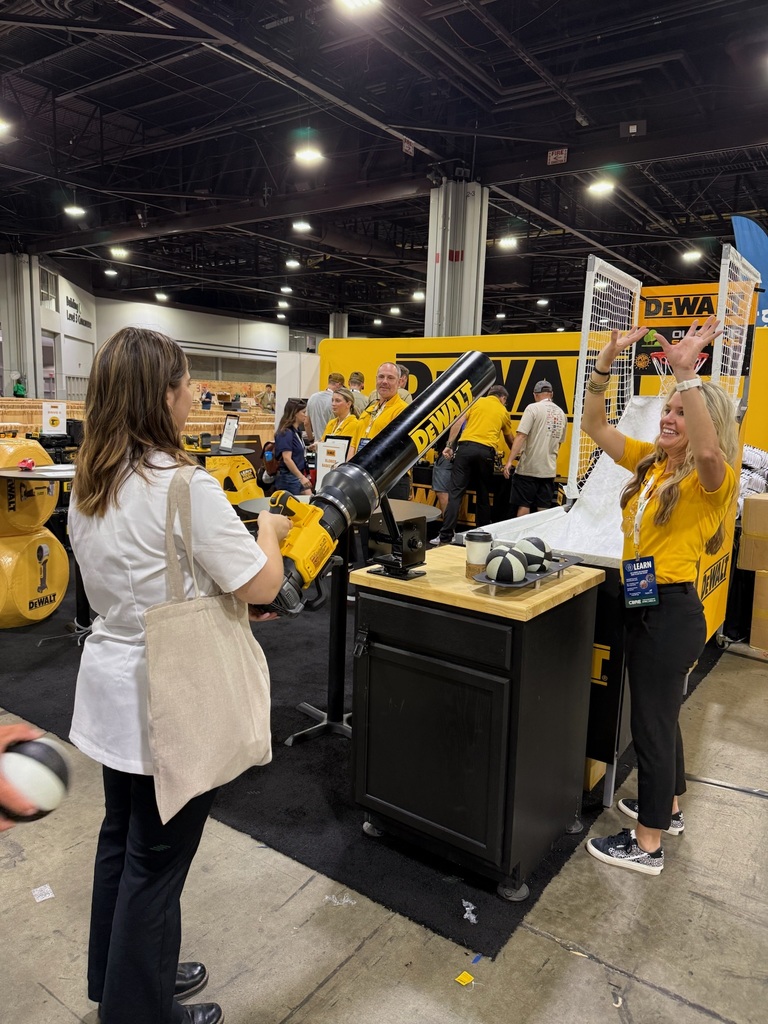 A BCTC student tries an activity at a DEWALT booth during the SkillsUSA National Leadership & Skills Conference expo.