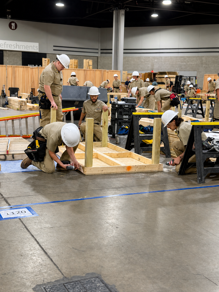 SkillsUSA competitors build a wooden structure during the construction competition.