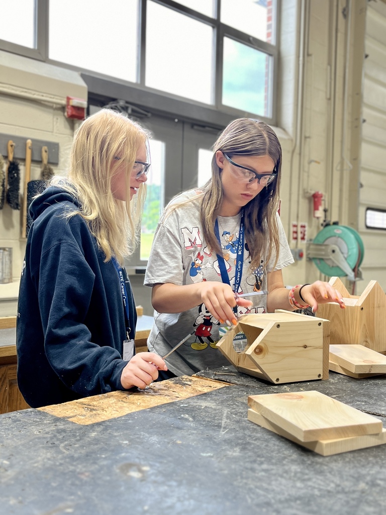 Two Career Camp participants work together on a wooden birdhouse project in a BCTC lab.