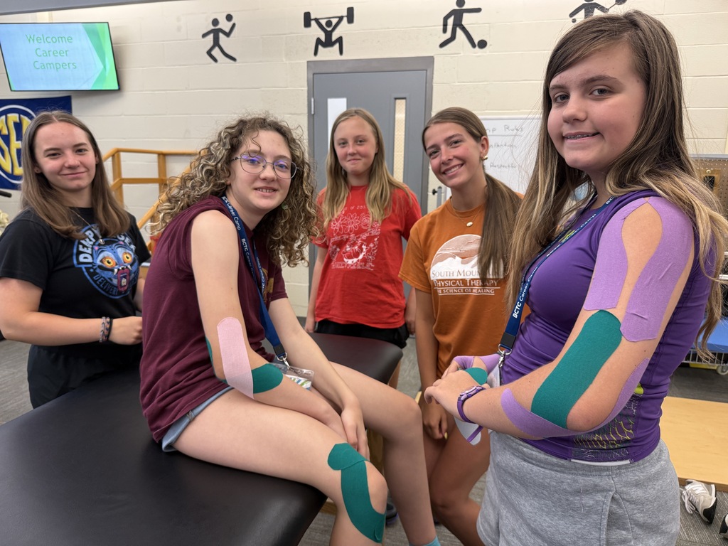 Career Camp participants show colorful athletic tape applied during a health skills activity.