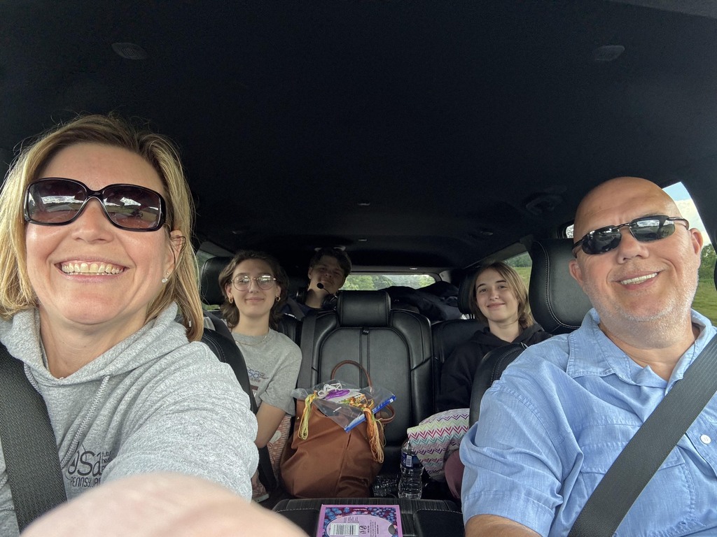 BCTC HOSA students and advisors smile for a selfie while traveling together in a vehicle.