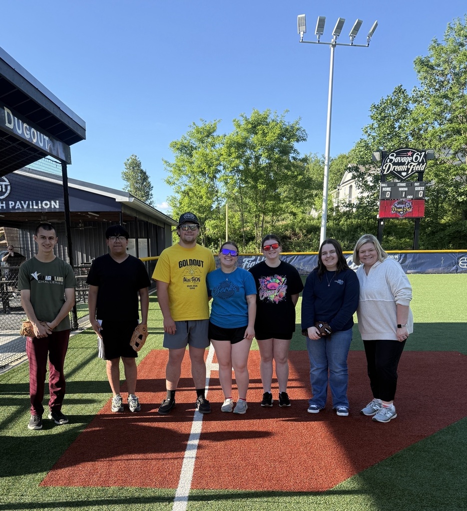 BCTC National Technical Honor Society students and advisors stand together at home plate at Savage 61 Dream Field.
