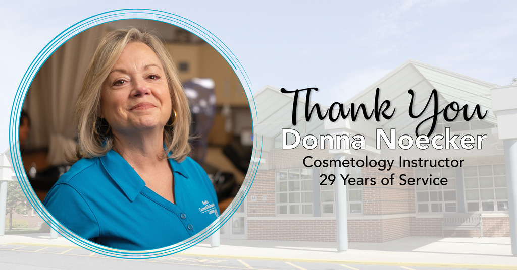 Donna Noecker, wearing a teal BCTC polo, poses in a cosmetology classroom. The graphic reads, “Thank You Donna Noecker, Cosmetology Instructor, 29 Years of Service,” over a faded image of the BCTC campus.