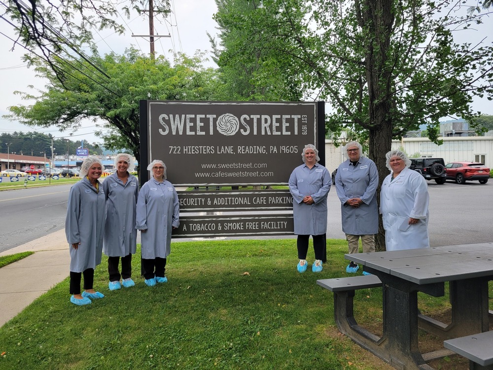 iBb participants in front of Sweet Street Sign