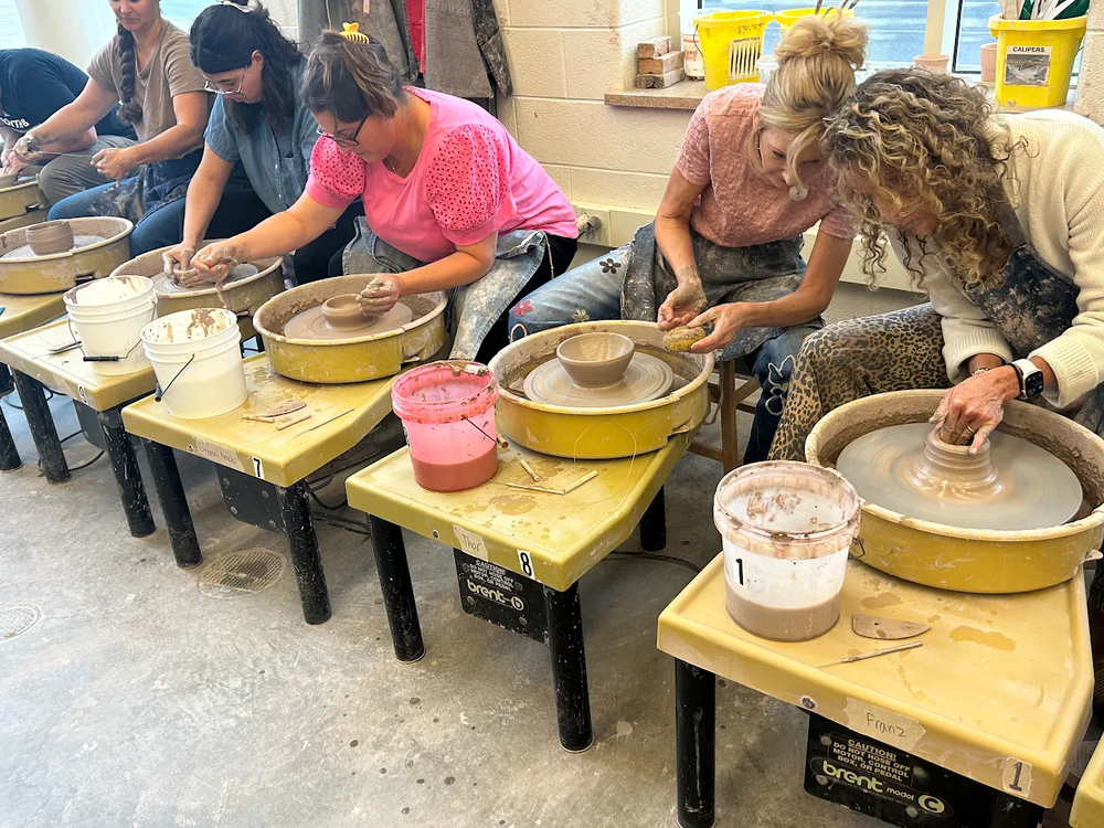 Art educators participating in pottery during Common Inservice