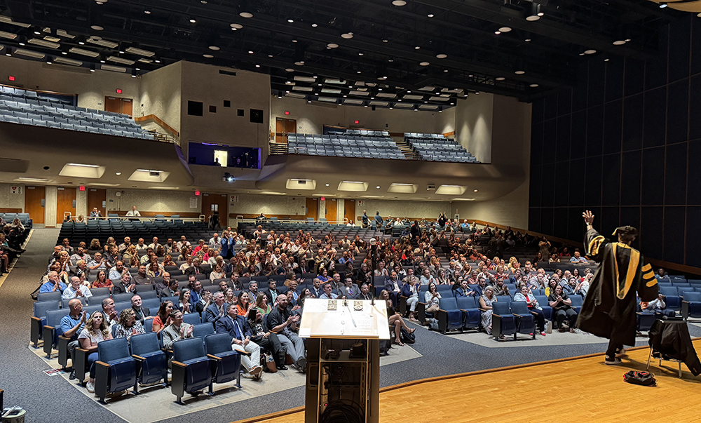 Audience at 2025 Administrators' Conference with Dr. Adolph Brown Presenting on Stage