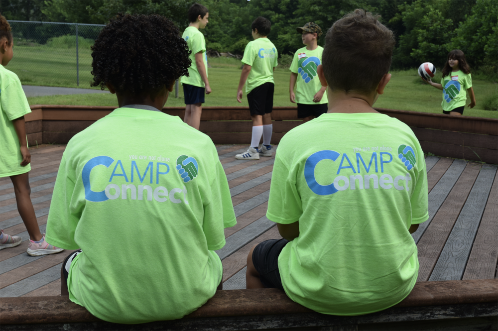 Students in green shirts at camp connect
