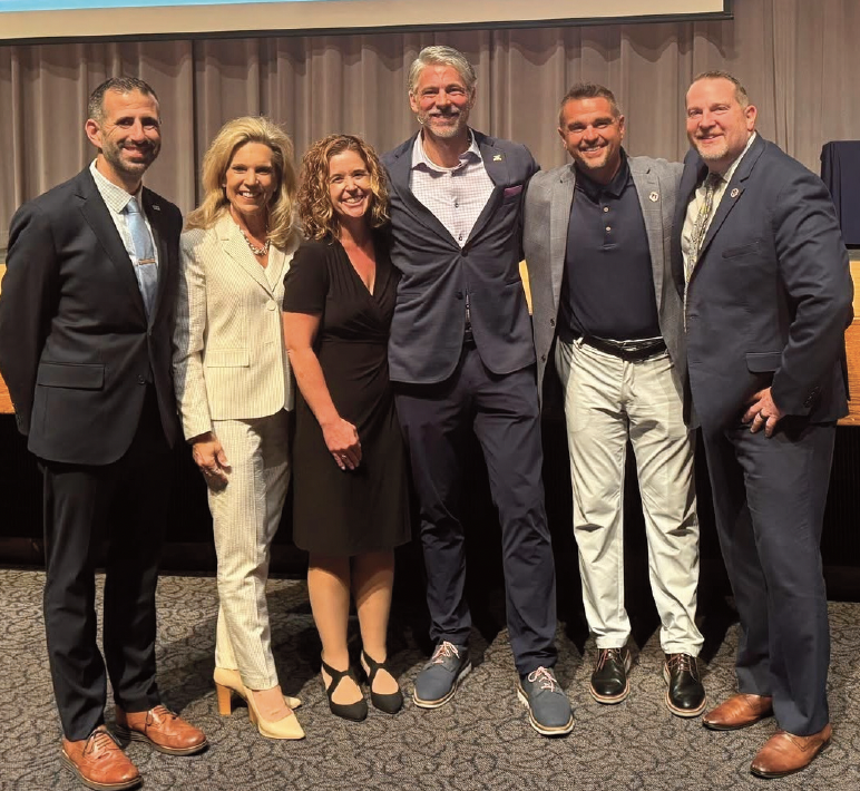 Group of administrators standing and smiling