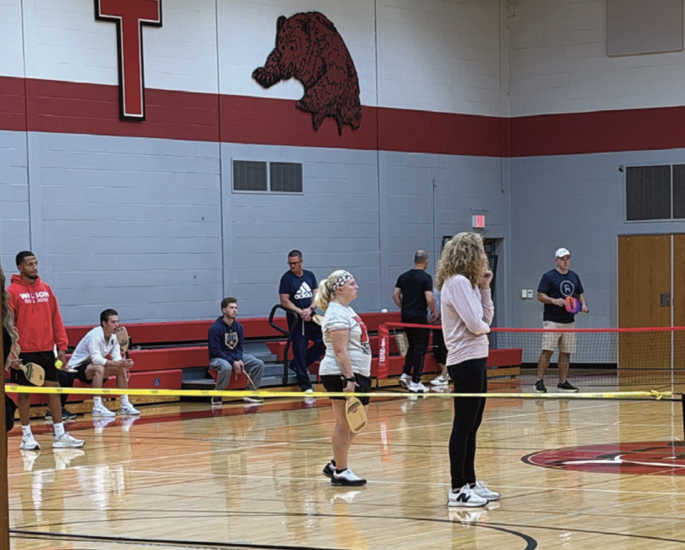 PE Educators Participating in Professional Development in a Gymnasium