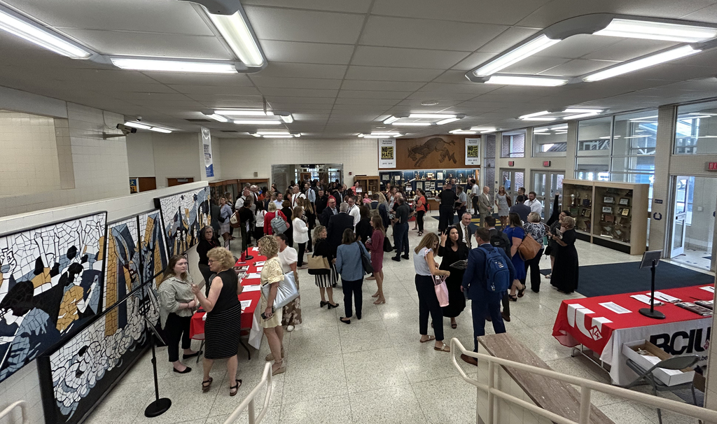Attendees Gathering in Library