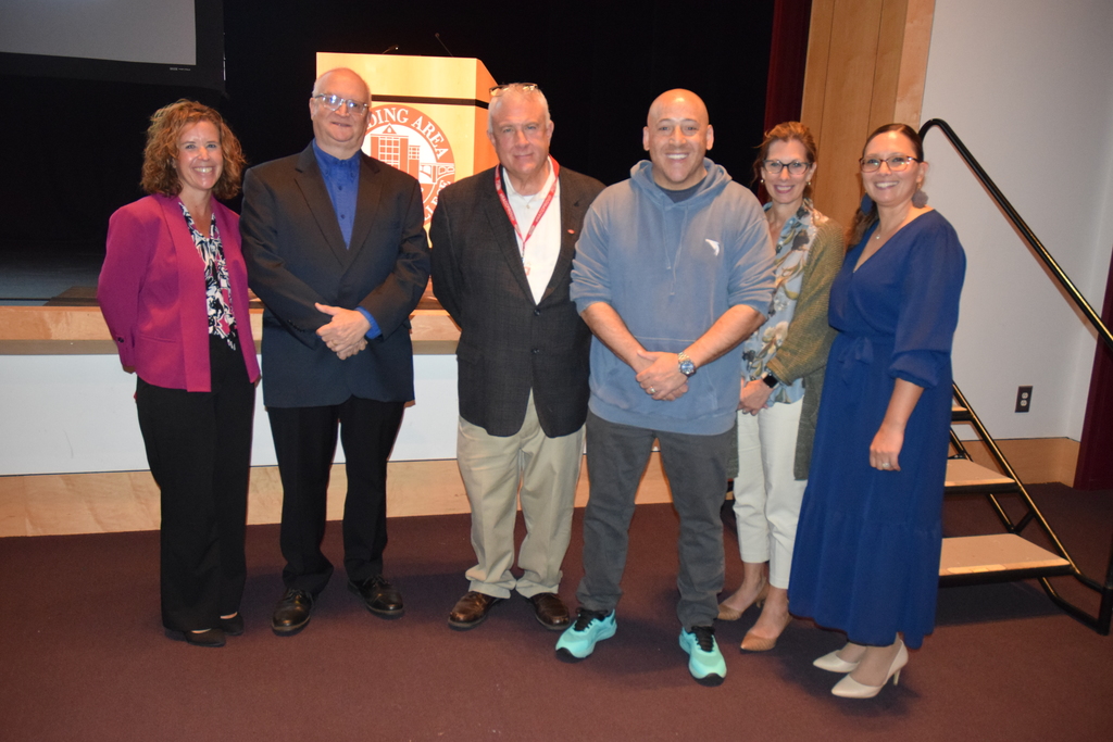 Kevin Hines poses with staff.
