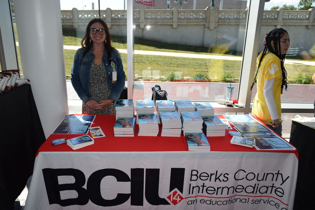 BCIU table with Kevin Hine's books and mental health resources.