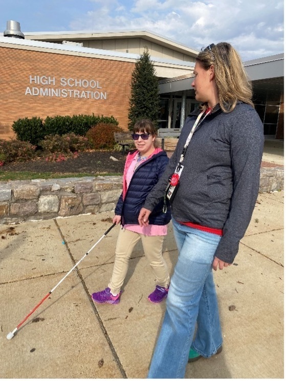 Sheri Hoffert, TVI & COM Specialist, provides services to Gail K., a student from the Wilson School District, outside her home district building.