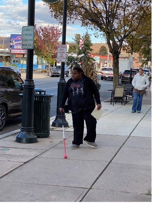 Student working on community-based mobility skills