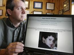 John  Halligan showing a picture of his son