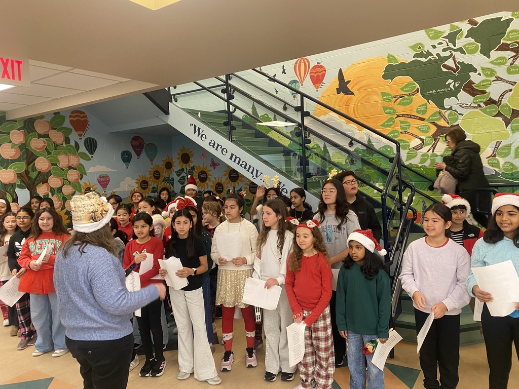 Chorus teacher and students singing