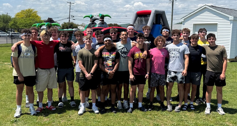 football team standing in a group