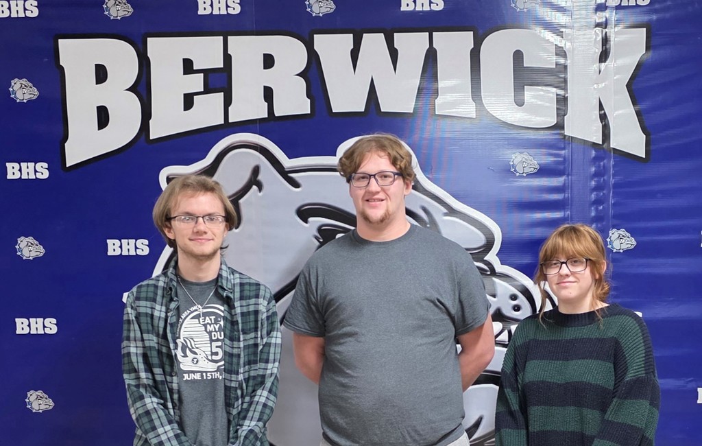 December students of the month standing in a g roup