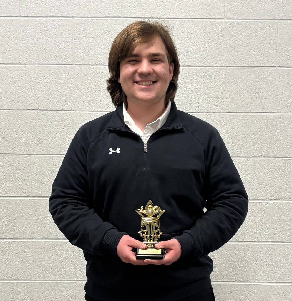 quiz bowl team member with trophy