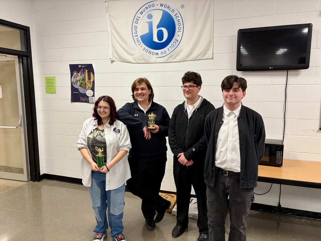 quiz bowl team with trophy