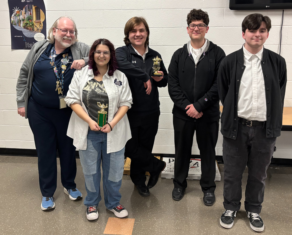 quiz bowl team standing in a group