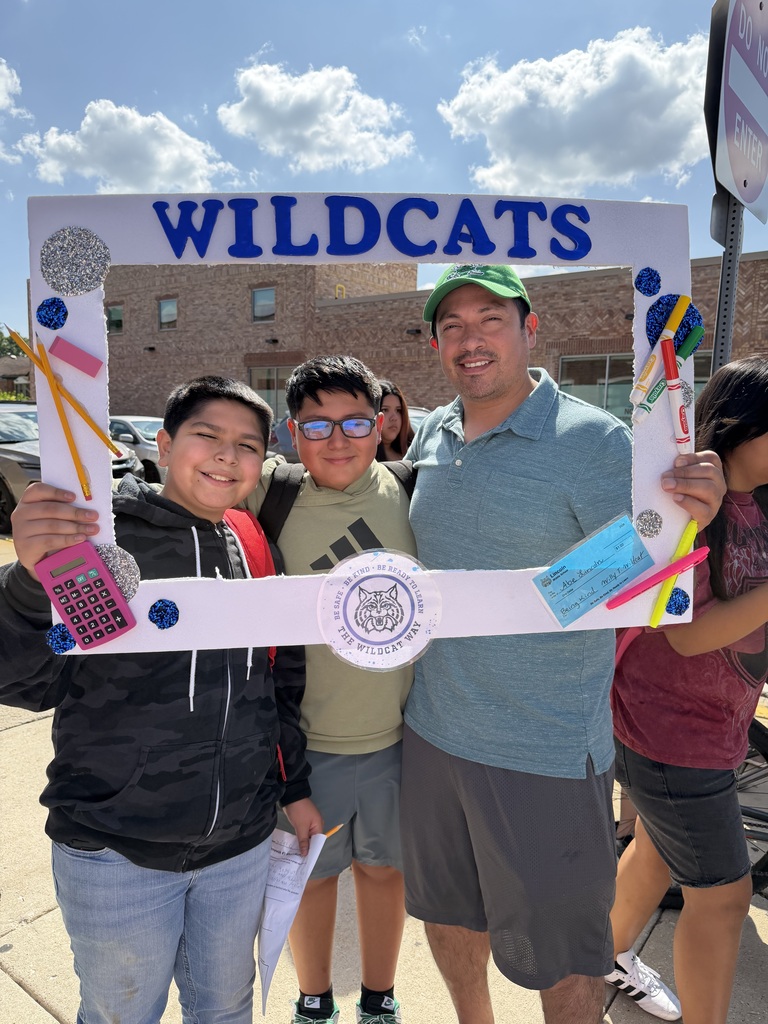 two students and a teacher holding wildcats photoframe