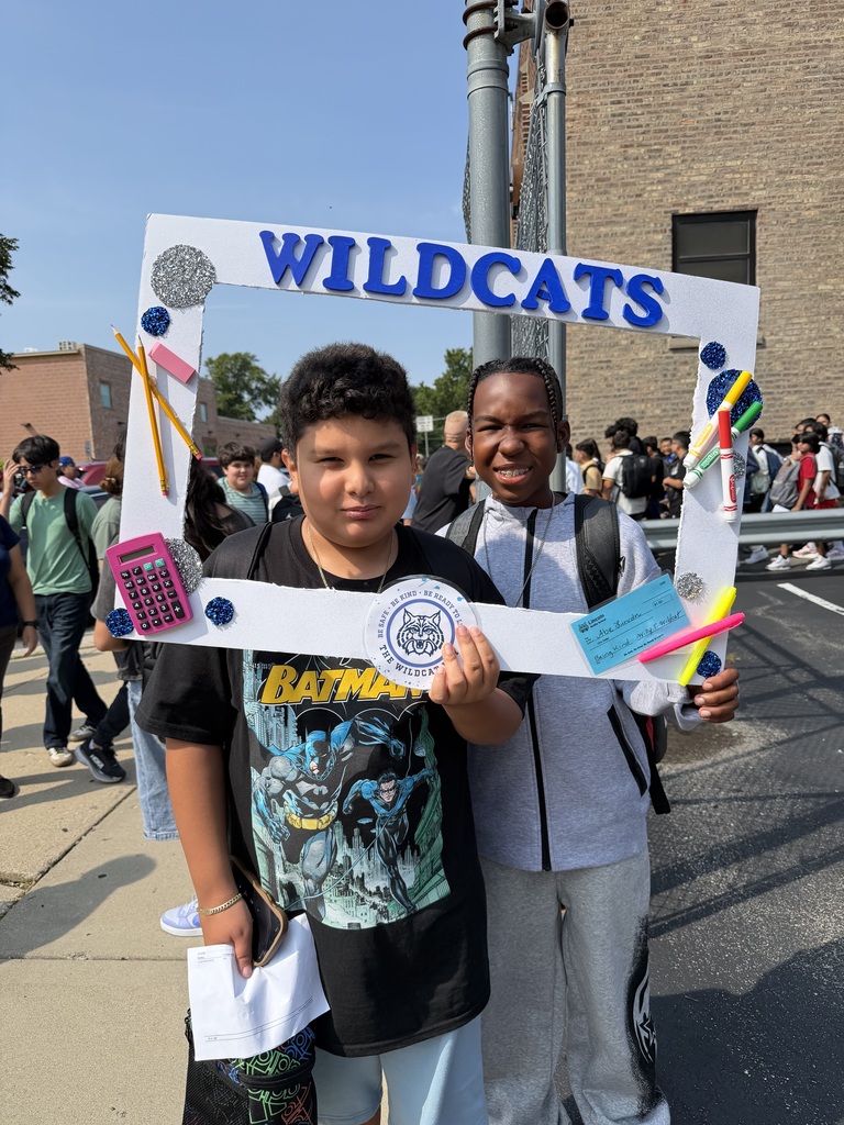 two students holding wildcats photoframe