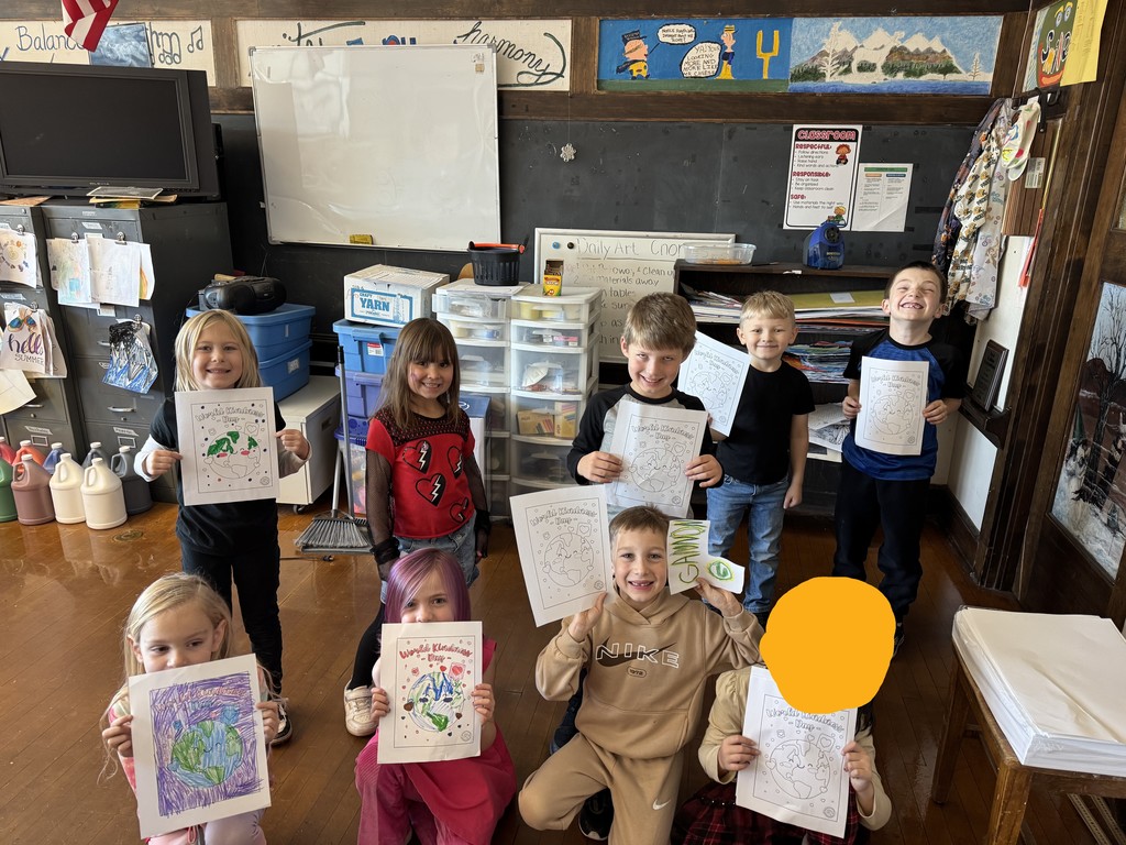 students holding coloring sheets