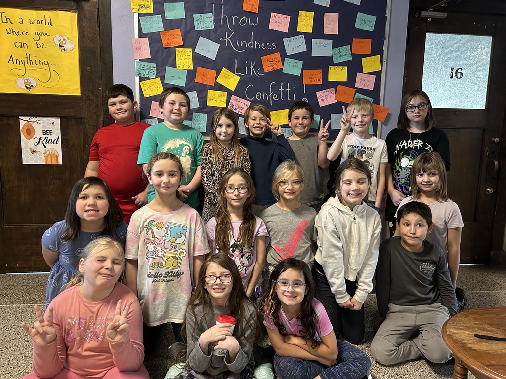 Students in front of kindness board