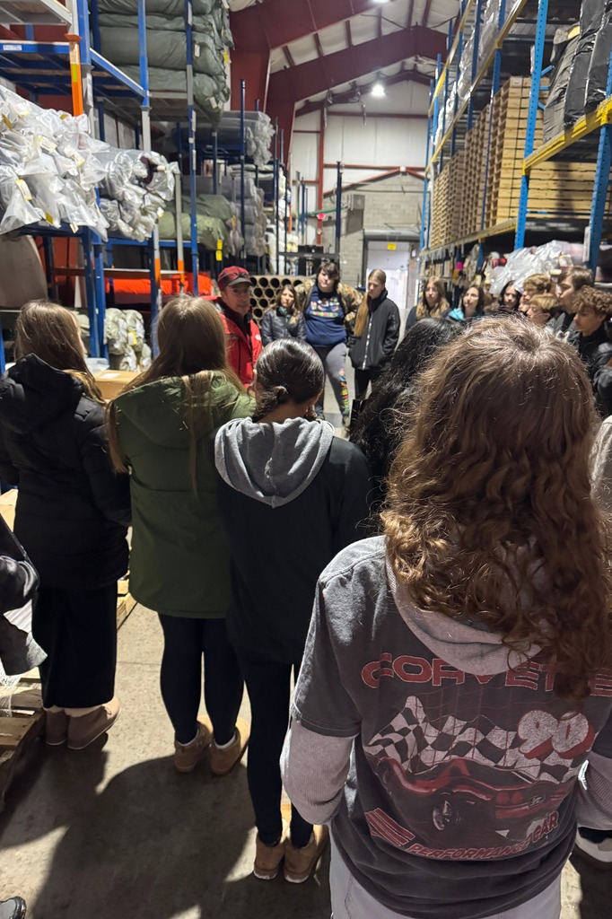 Bob Jaquart teaching students about fabric and textiles