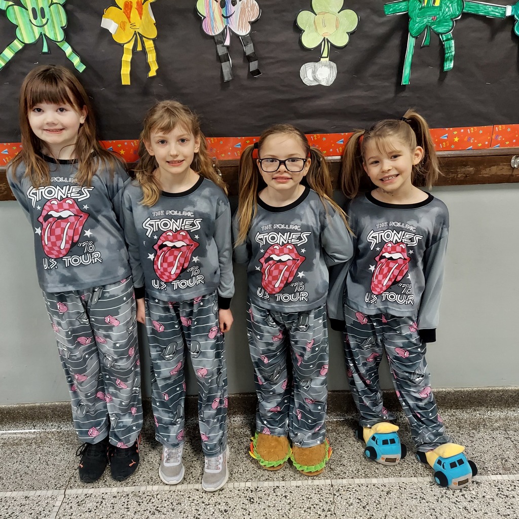 four girls dressed in matching pajamas