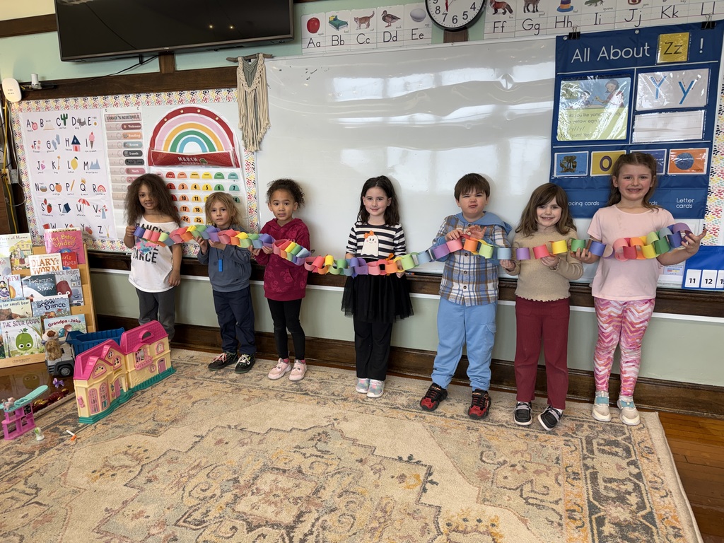 kids holding a paper chain indicating how many days are left of school