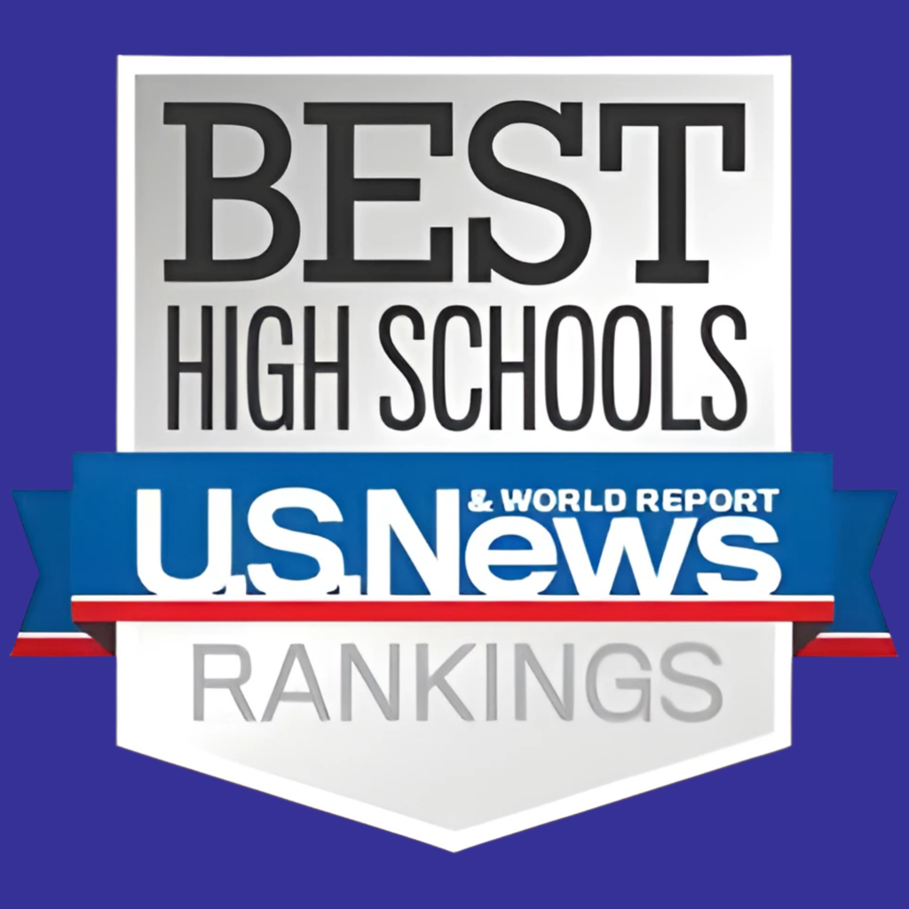 A graphic badge with a silver shield background and a blue border ribbon. At the top, bold black text reads “BEST HIGH SCHOOLS.” Across the middle, a blue, white, and red banner displays the logo “U.S. News & World Report.” At the bottom, gray text on the shield reads “RANKINGS