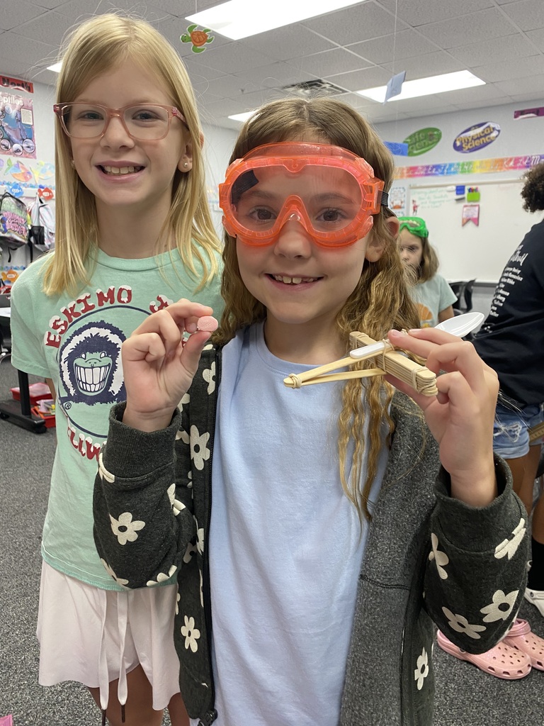 2 girls with a catapult