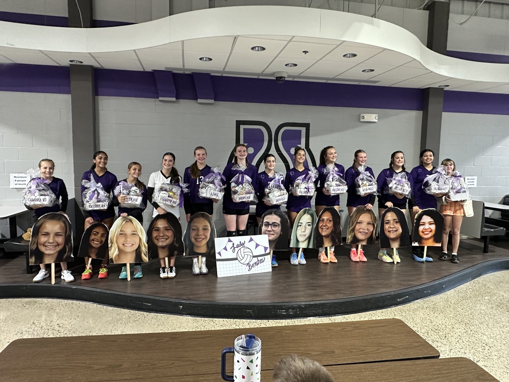 100125 8th grade volleyball players with end of season gifts