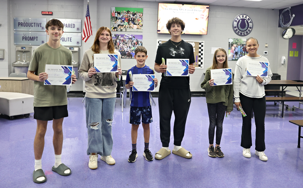 image of six students holding student of the month certificates