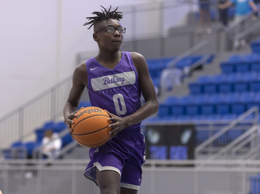 picture of 7th grade boys basketball player going for a lay up