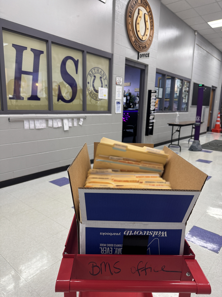 picture of 8th grade folders in front of HS office