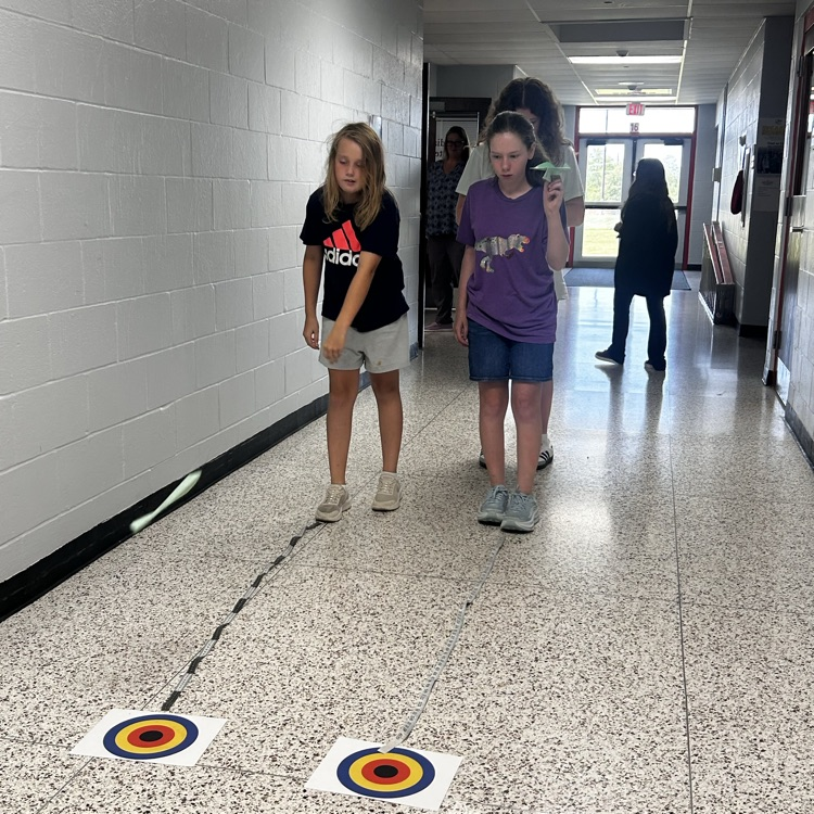 6th grade PLTW making paper airplane gliders to learn about the design process and using an engineer’s notebook to document their designs. 